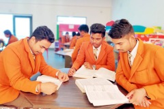 Students reading Books in School Library